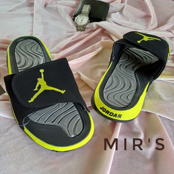 Image of a pair of Green Jordan Slides