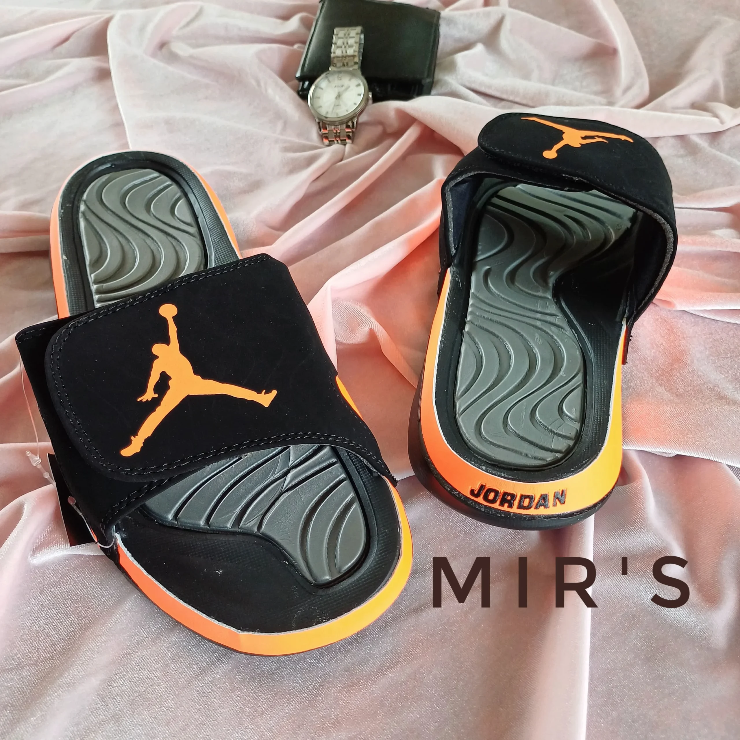 Image of a pair of Orange Jordan Slides